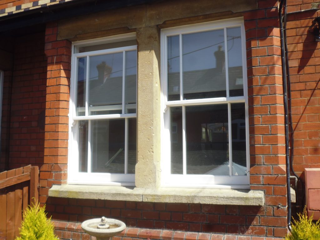 Heritage sliding sash windows with astragals